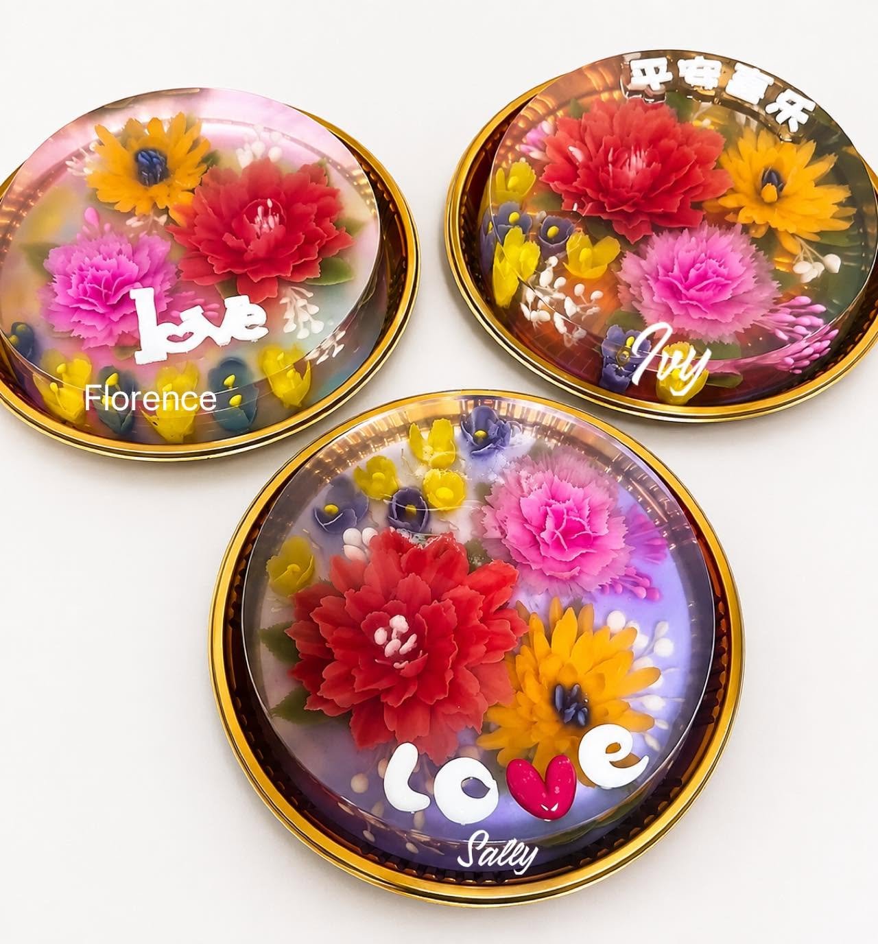 Three round tin jelly cakes made by students Florence, Ivy and Sally